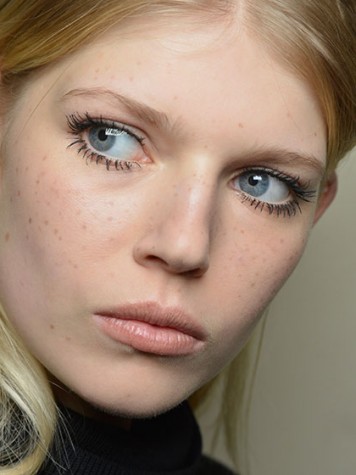 Clumpy lashes and freckles are in. (Photo courtesy of Allure.com)